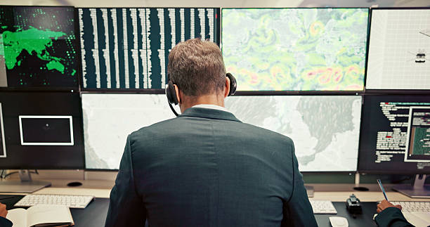 istock Headset, back or man with screen for maps for news, research or ecology in data center. Pattern, check or computer for tracking technology for meteorology info, storm radar or climate change forecast 2210543788