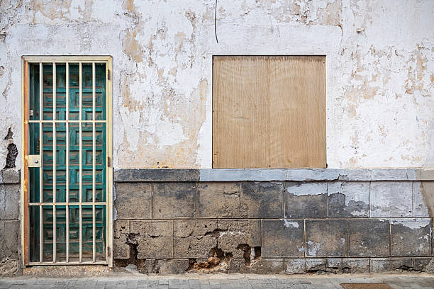 istock Secured Entrance and Boarded Window – Urban Decay and Protection 2210543914