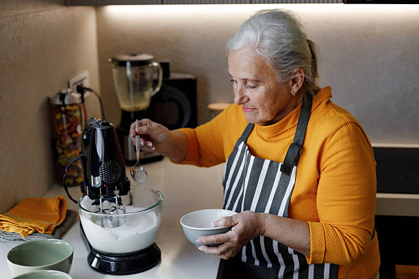 istock Grandma making cookie dough in her kitchen 2210546625