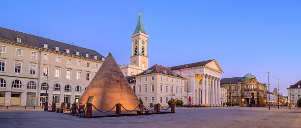 istock Karlsruhe Marktplatz features pyramid structure and fountain display during twilight hours 2210548344