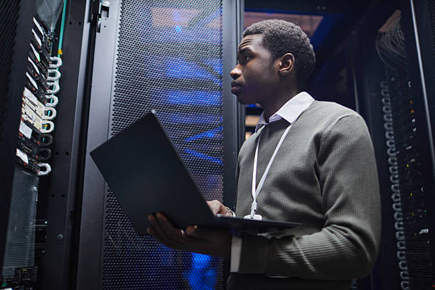 istock Managing Server Room Operations with Laptop in Hand 2210550022