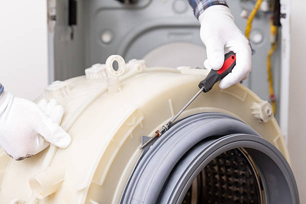 istock Washing machine maintenance with tools and gloves for effective repair service 2210551698