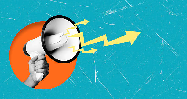 istock Modern art collage featuring a hand with a megaphone on a blue background with space copy and lightning. 2210552848