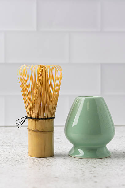 istock Bamboo whisk and matcha bowl resting on marble countertop 2210557846