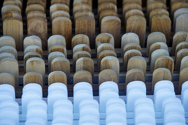 istock Wooden and White Stacked Shapes in a Neat Row Displaying Patterns 2210558224