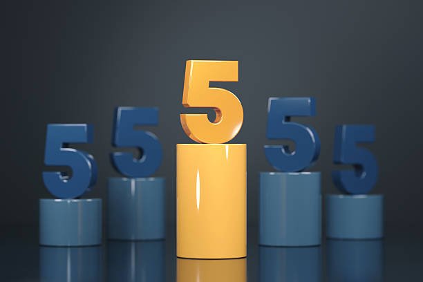 Number 5 Sitting On Orange Podium With Dark Background. Numbers Concept.