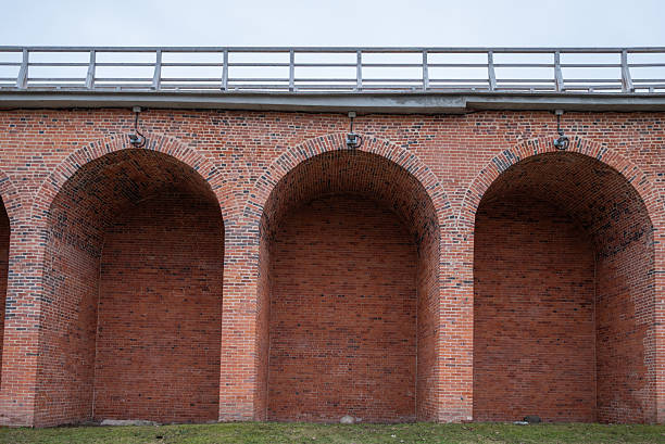 istock The brick archway is empty and has a very old look to it 2210561432