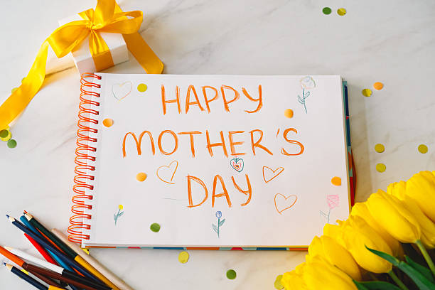 istock A boy diligently creating a heartfelt Mothers Day card 2210562817