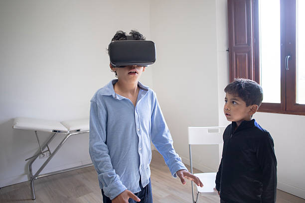 istock Child wearing VR glasses 2210563924