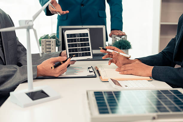 istock Smart new generation design engineers designing renewable and solar energy systems for wind turbine projects, working on wind turbine and solar installations. 2210565153