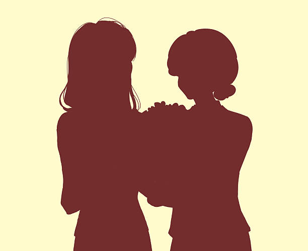 istock A woman giving a bouquet to an elderly woman 2210567603