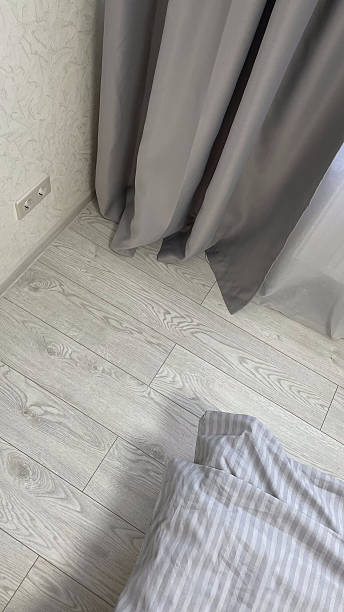istock beautiful home interior in modern style, gray curtains laminate and bed linen 2210567656