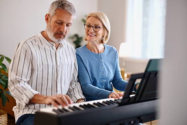istock Modern couple playing piano 2210569339