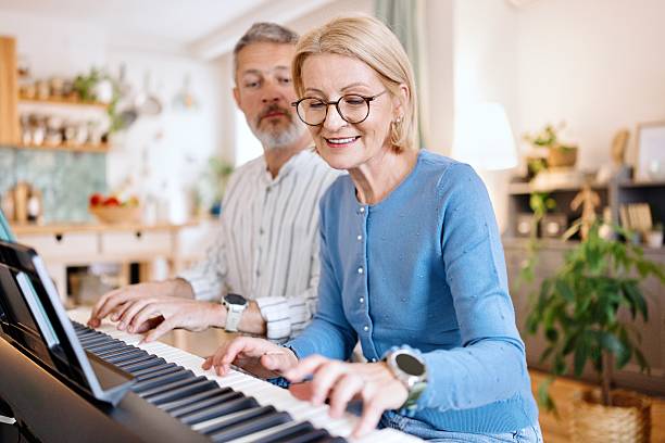 istock Woman playing piano with her husband 2210569930
