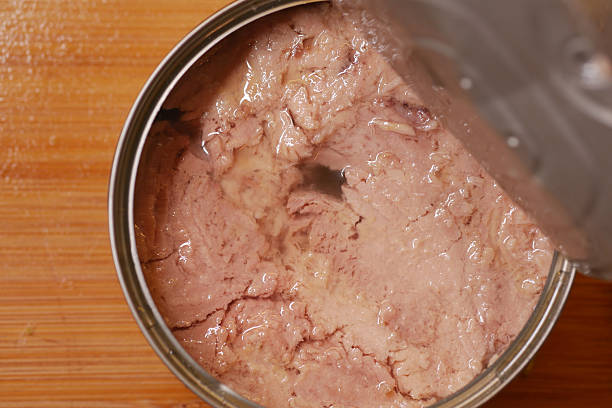 istock canned tuna on wooden table , 2210570416