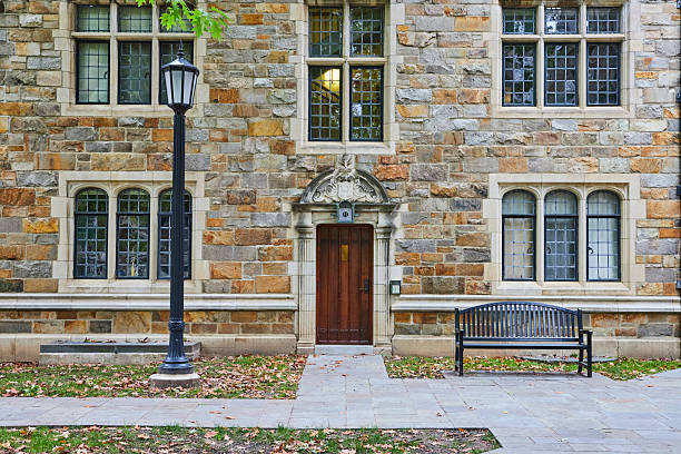 istock Traditional University Building with Lamppost and Bench 2210570734