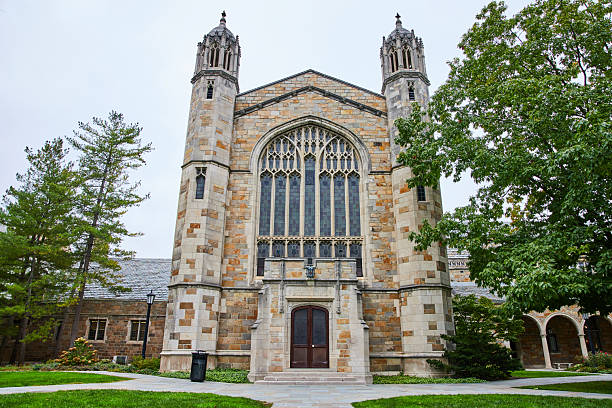 istock Gothic Style University Building with Manicured Lawn - Eye-Level View 2210570863