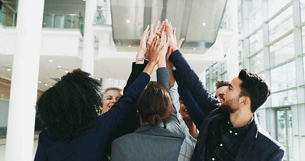 istock Business people, high five and circle for target in office, motivation support and synergy huddle. Employees, team building and together for company bonding, about us and partnership in workplace 2210571240