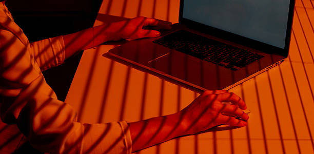 istock Freelancer Working at Sunset with Laptop and Mouse. 2210571460