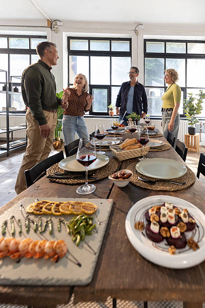 istock Diverse Friends Enjoying a Lively Indoor Dinner Party with Elegant Table Setting 2210572354