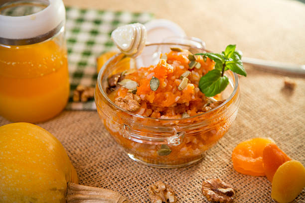 istock Cooked pumpkin porridge with rice, nuts and honey 2210572435