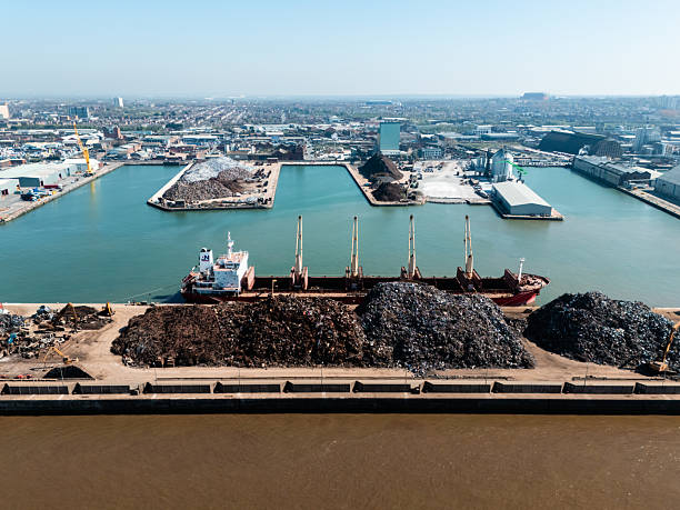 Aerial view of a cargo ship being loaded with scrap metal at the port of liverpool