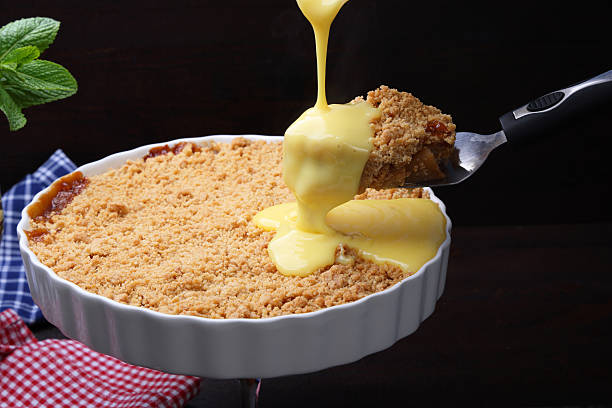 istock Apple Crumble and sweet custard with serving size on spatula 2210575090