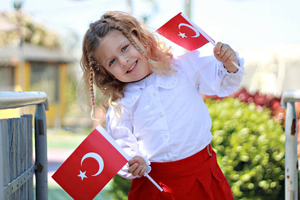 istock Girl carrying Turkish flag 2210577924