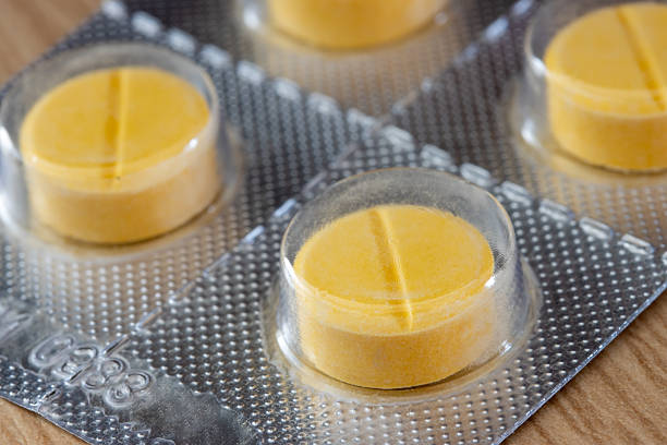 istock A yellow tablets in blister pack, close up. 2210577934