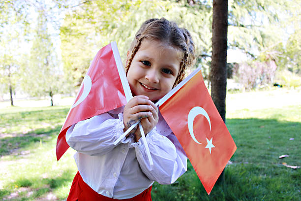 istock Girl carrying Turkish flag 2210578001