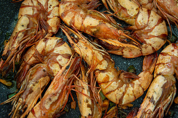 istock Large tiger shrimps fried in hot pan. 2210578468