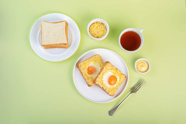 istock Sandwich with egg and cheese in a plate 2210580419