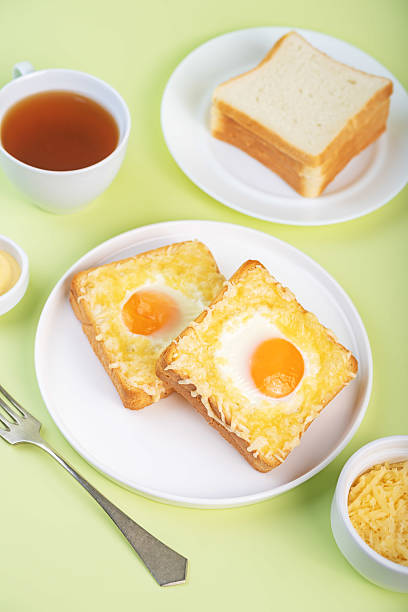 istock Sandwich with egg and cheese in a plate 2210580434