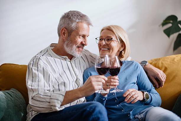 istock Portrait of a couple drinking wine while relaxing 2210583567
