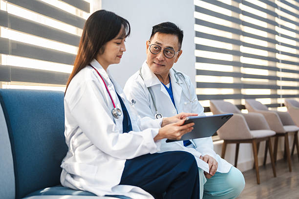 istock Two Dedicated Surgeons Collaborate with Digital Technology to Explore Complex Medical Cases in a Hospital Setting 2210585156