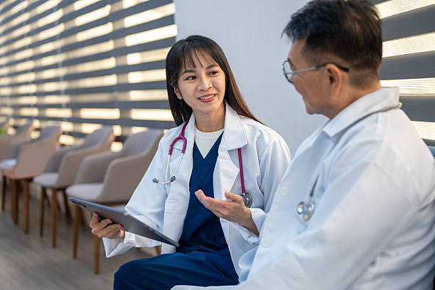 istock Where Compassion Meets Innovation: Two Surgeons Collaborate in a Hospital Setting to Deepen Their Understanding of Medical Cases 2210585176