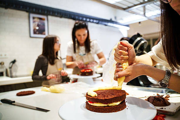 People Decorating Cakes in a Modern Kitchen – Baking Class or Workshop