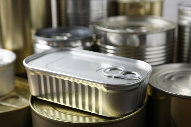istock Many closed tin cans as background, closeup 2210588411