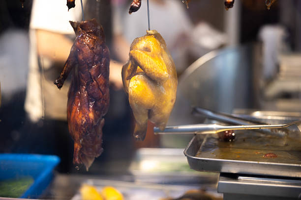 Cooked ducks hang in the restaurant display.Hong Kong Island.