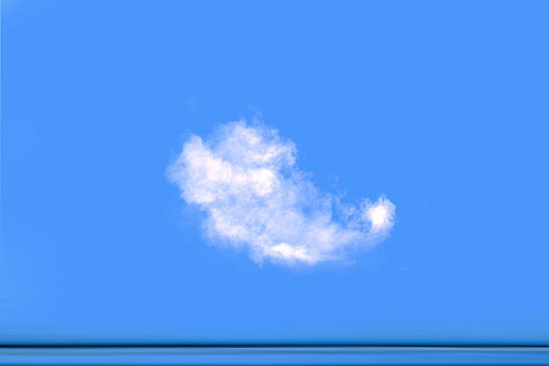 A minimal image of a single white cloud or smoke puff isolated against a clean blue background. The image provides generous copy space and can be interpreted as natural or abstract, suitable for design, advertising, or conceptual use.