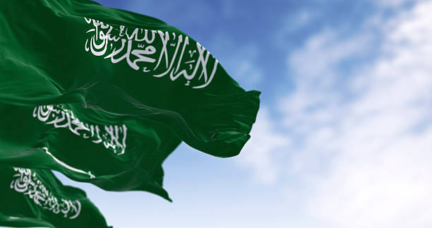 istock Saudi Arabian flag with Arabic calligraphy waving in the wind. 3D render 2210591199