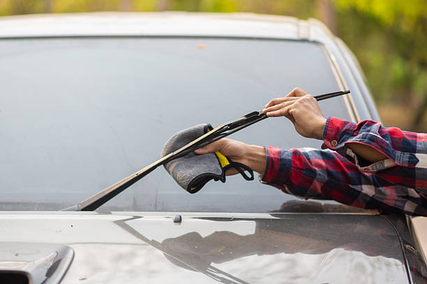 istock The man is checking the engine and condition of car to fix it properly and safely before traveling long distances. The man is checking condition of the car and the engine before traveling for safety. 2210591346