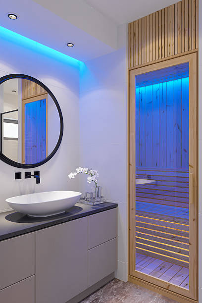 istock Modern Home Spa Bathroom with Finnish Pine Sauna and Blue Accent Lighting 2210591696
