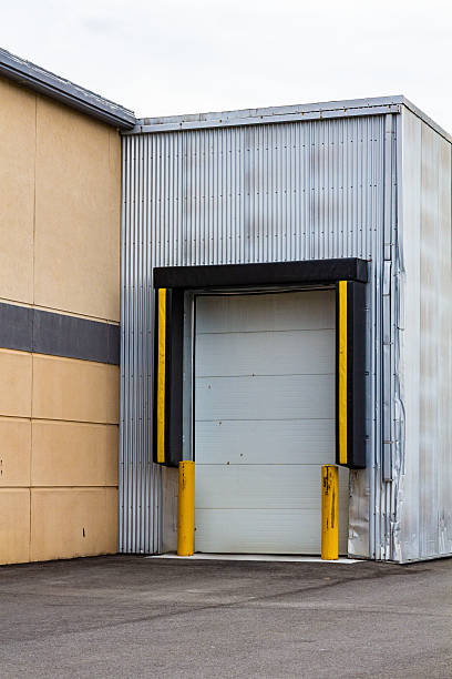 istock Modern Industrial Loading Dock with Safety Bollards and Rolling Door 2210594446
