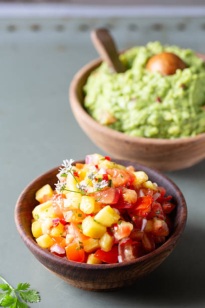 istock Classic Guacamole and fresh pineapple and tomato salsa 2210597085