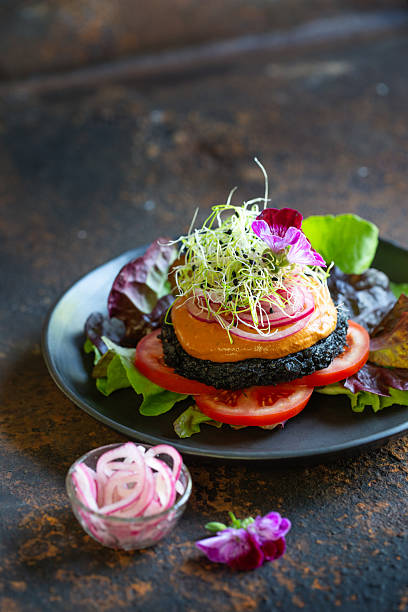 Raw food mushroom burger topped with sprouts