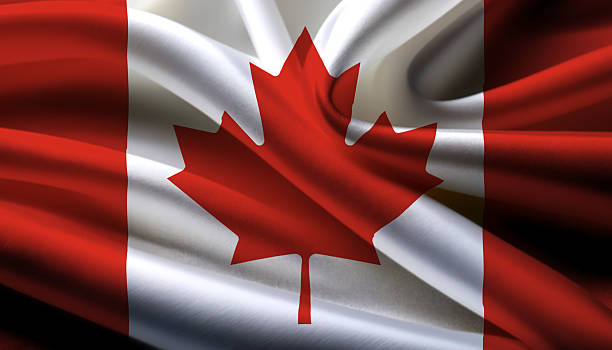 istock canada national flag on wavy background 2210599070