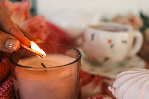 istock Flat lay with a cozy pink tea setting, meringues, candle being lit, tulips, and soft textures. Feminine and romantic atmosphere with sweet treats and warm ambiance 2210600185