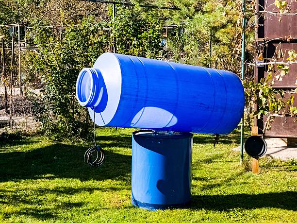 istock Cleaning of a drinking water container. A blue plastic container for clean water is drying in sun. 2210602347