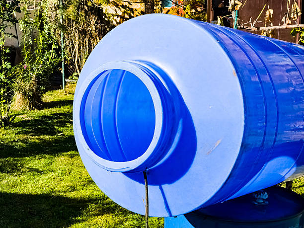 A blue plastic container for clean water is drying in the sun